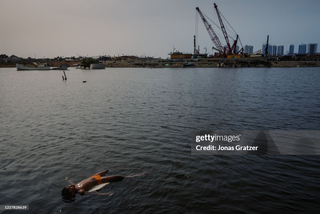 A Child is playing in the seawater that now permanently...