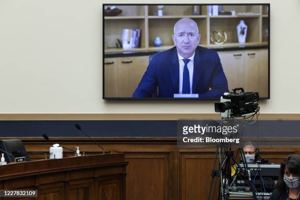 Jeff Bezos, founder and chief executive officer of Amazon.com Inc., speaks via videoconference during a House Judiciary Subcommittee hearing in...