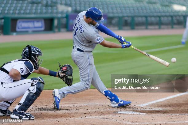 Bubba Starling of the Kansas City Royals singles to drive in Adalberto Mondesi as Grayson Greiner of the Detroit Tigers works behind the plate during...