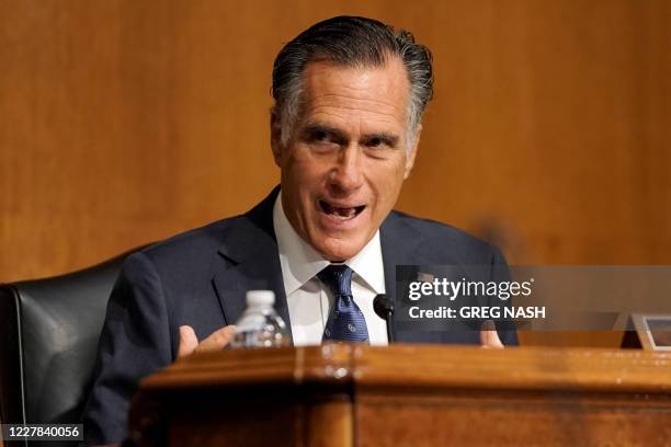 Sen. Mitt Romney asks a question to Secretary of State Mike Pompeo as he testifies before a Senate Foreign Relations committee hearing on the State...