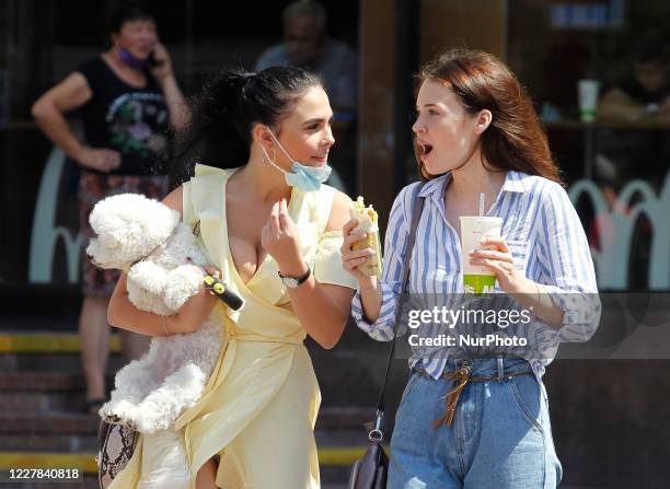 Young women talk on a street in Kyiv, Ukraine, on 30 July, 2020. Ukrainian capital set an anti-record for the number of the COVID-19 confirmed cases...