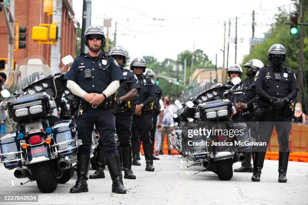 Atlanta Police officers line the street outside of Ebenezer Baptist Church for the funeral of civil rights icon, US Rep. John Lewis on July 30, 2020...