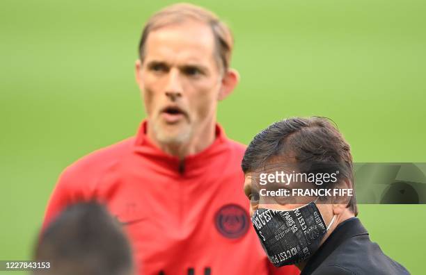 Paris Saint-Germain's Brazilian sporting director Leonardo and Paris Saint-Germain's German head coach Thomas Tuchel look on ahead of a training...