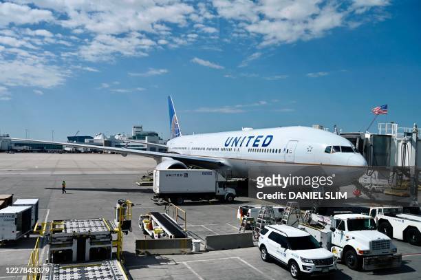 Boeing 777/200 of United Airlines is seen at the gate at Denver International Airport on July 30 in Denver, Colorado.