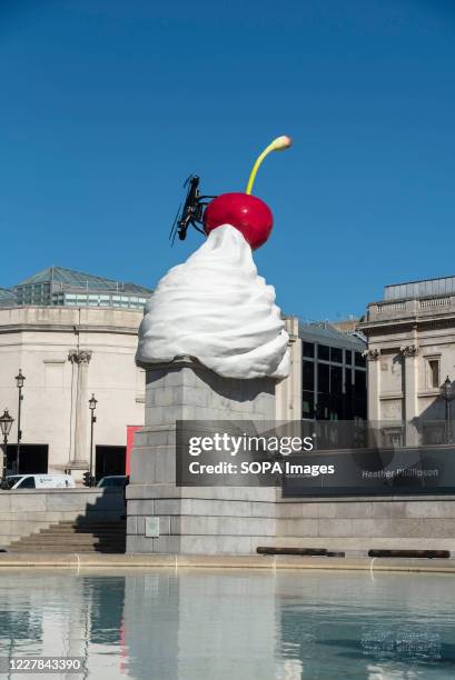 Giant swirl of replica whipped cream topped with a cherry, a fly and a drone was unveiled on the 4th Plinth at Trafalgar Square, central London...