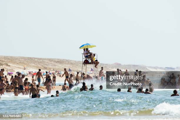 Tourists enjoy a day out the beach and the swimming area in Moliets-et-Maa, Nouvelle Aquitaine, France, on July 30, 2020. While the coronavirus crise...