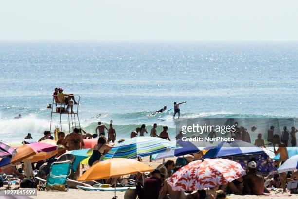 Tourists enjoy a day out the beach and the swimming area in Moliets-et-Maa, Nouvelle Aquitaine, France, on July 30, 2020. While the coronavirus crise...