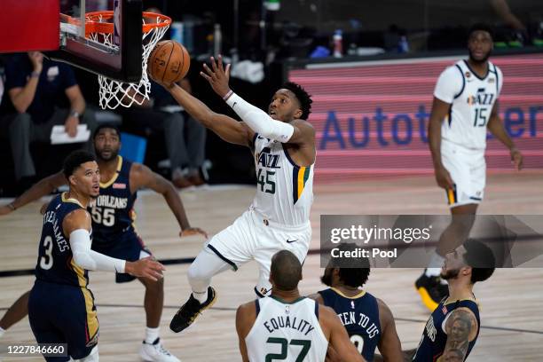 Donovan Mitchell of the Utah Jazz drives to the basket against the New Orleans Pelicans during the first half at HP Field House at ESPN Wide World Of...