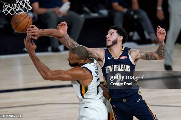 Rudy Gobert and Lonzo Ball of the New Orleans Pelicans battle for a loose ball during the second half at HP Field House at ESPN Wide World Of Sports...