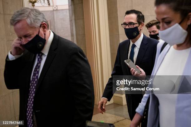 Treasury Secretary Steven Mnuchin and White House Chief of Staff Mark Meadows leave the U.S. Capitol after speaking to reporters outside of Speaker...