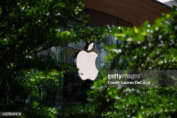 The Apple logo shining on the front of Apple Central World on the stores opening day on July 31, 2020 in Bangkok, Thailand. Apple's second, and...