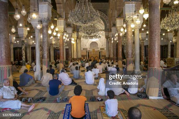 Muslims arrive to perform Eid al-Adha prayer by implementing social distancing and health protocol during coronavirus outbreak at the Al-Zaytuna...