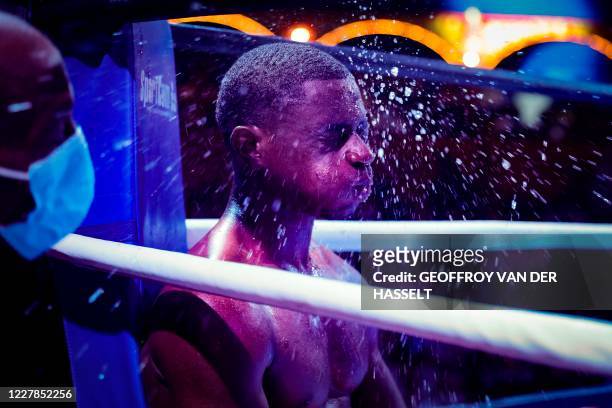 French boxer, Christ Esabe reacts during a time out during the Fighting Nation box evening, the first post covid indoor event, inside the Bormann...