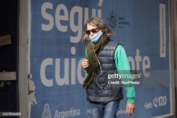 Woman wearing a protective mask walks in Buenos Aires, Argentina, on July 31, 2020. The City of Buenos Aires will continue in phase 3 of the COVID-19...