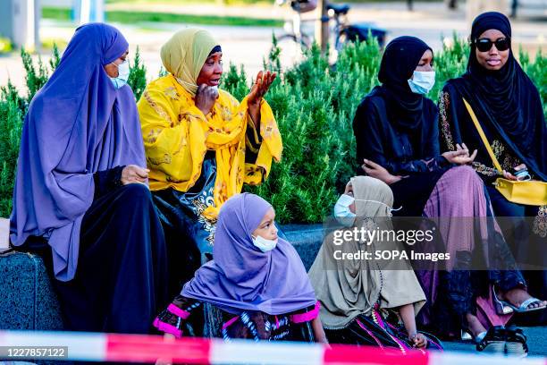 Muslim women interacting outside Essalam mosque during Eid al-Adha amid Coronavirus crisis. Eid al-Adha, also called Eid Qurban or Bakra-Eid, is the...