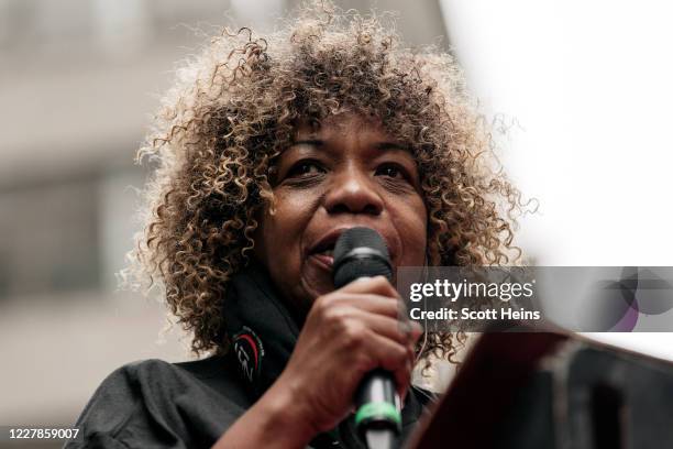 Gwen Carr, mother of Eric Garner, speaks at a post-march rally led by family members of victims of police brutality in the Midtown neighborhood of...