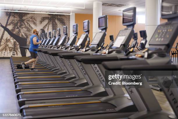 Person runs on a treadmill at a gym in Toronto, Ontario, Canada, on Friday, July 31, 2020. In Stage 3, indoor dining can resume at bars and...