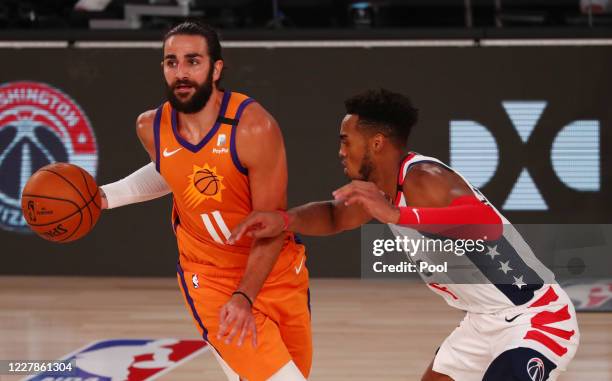 Phoenix Suns guard Ricky Rubio is defended by Washington Wizards forward Troy Brown Jr. #6 in the second half of a NBA basketball game at ESPN Wide...