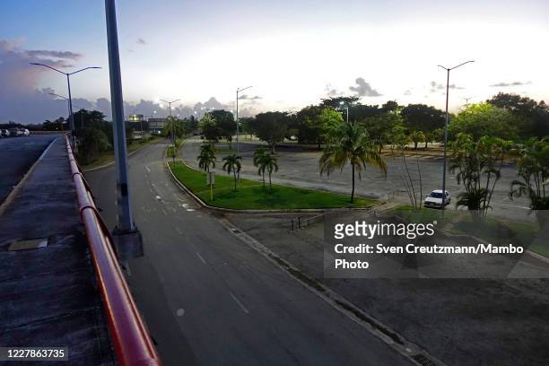 The almost empty parking lot of the international terminal of Havanas airport Jose Marti is seen, on July 31 in Havana, Cuba. Cuba has announced that...
