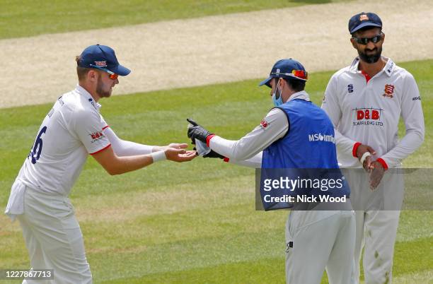 Essex players clean their hands during an interval at Cloudfm County Ground on August 1, 2020 in Chelmsford, England.