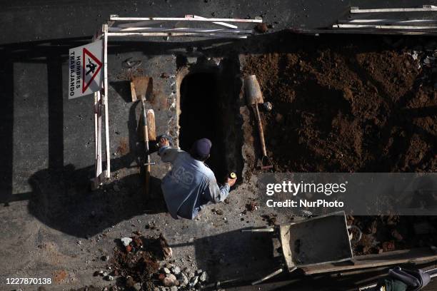 Construction workers making arrangements on public roads in Buenos Aries, Argentina on August 1, 2020. The City of Buenos Aires will continue in...