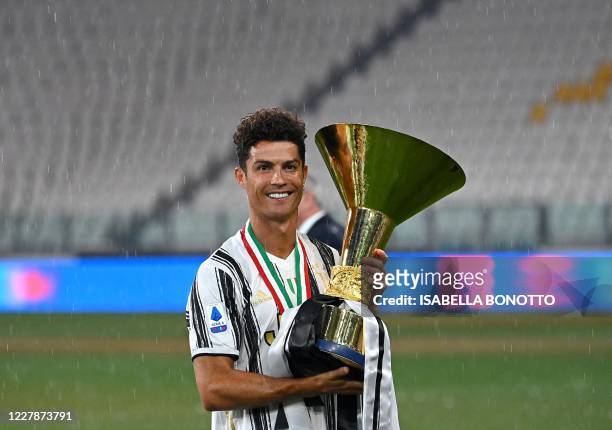 Juventus' Portuguese forward Cristiano Ronaldo kisses the Champion's trophy at the end of the Italian Serie A football match Juventus vs Roma on...