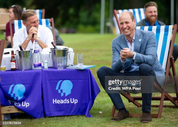 Prince William, Duke of Cambridge with former Arsenal player, Tony Adams as he hosts an outdoor screening of the Heads Up FA Cup final on the...
