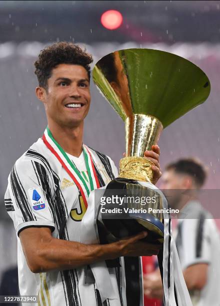 Cristiano Ronaldo of Juventus FC poses with the trophy after the Serie A match between Juventus and AS Roma at Allianz Stadium on August 1, 2020 in...