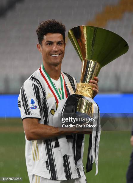 Cristiano Ronaldo of Juventus celebrates with the trophy after winning the 2019/20 Serie A Championship during the Serie A match between Juventus and...