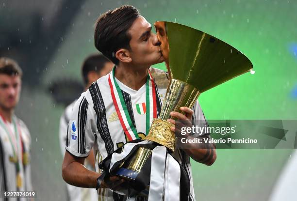 Paulo Dybala of Juventus FC kisses the trophy after the Serie A match between Juventus and AS Roma at Allianz Stadium on August 1, 2020 in Turin,...