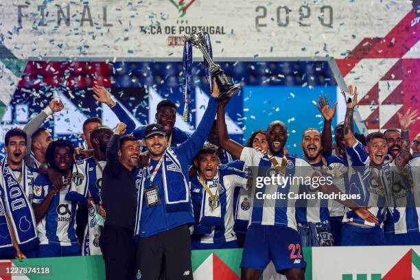 Sergio Conceicao, Iker Casillas, Danilo Pereira andFC Porto players rise the trophy after the Portuguese Cup Final match between SL Benfica and FC...