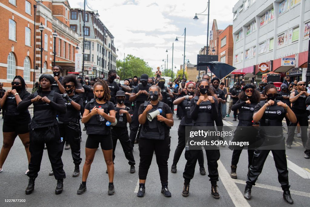 Members of FF Force AKA Forever Family chant slogans outside...