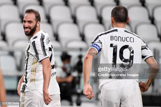 Gonzalo Higuain of Juventus celebrates with Leonardo Bonucci of Juventus during the Italian Serie A match between Juventus v AS Roma at the Allianz...