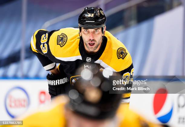 Zdeno Chara of the Boston Bruins watches a faceoff during the first period against the Philadelphia Flyers in a Round Robin game during the 2020 NHL...