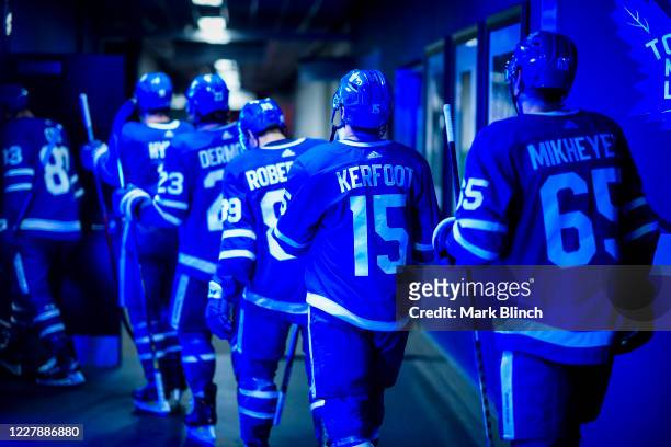 Nick Robertson, Alexander Kerfoot and Ilya Mikheyev of the Toronto Maple Leafs head to the ice to start the third period against the Columbus Blue...