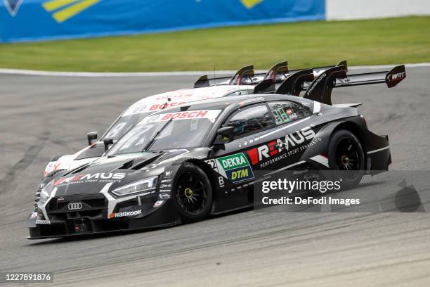 Ferdinand Habsburg of Austria for the WRT Team Audi Sport drives his Audi RS 5 DTM ahead of Robert Kubica of Poland for the Team Art Grand Prix...