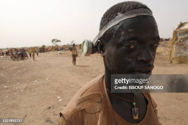 Man comes out of a hole where he was digging for gold, in Namisgma,the largest gold washing site in the country, some 200 kilometers from...