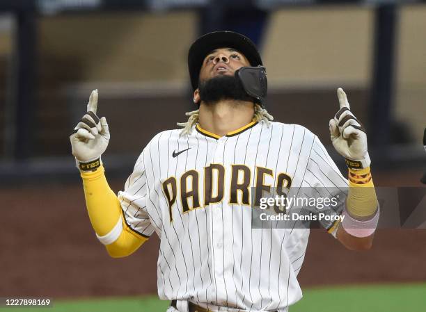 Fernando Tatis Jr. #23 of the San Diego Padres points skyward after hitting a solo home run during the fifth inning against the Los Angeles Dodgers...