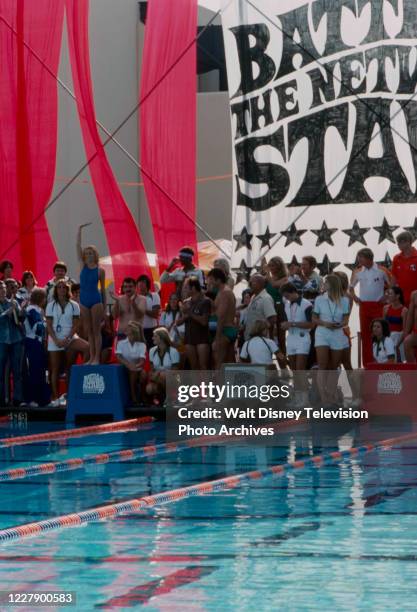 Suzanne Somers, Victor French, Lyle Waggoner, Telly Savalas competing in swimming competiton on the ABC tv special 'The Battle of the Network Stars...