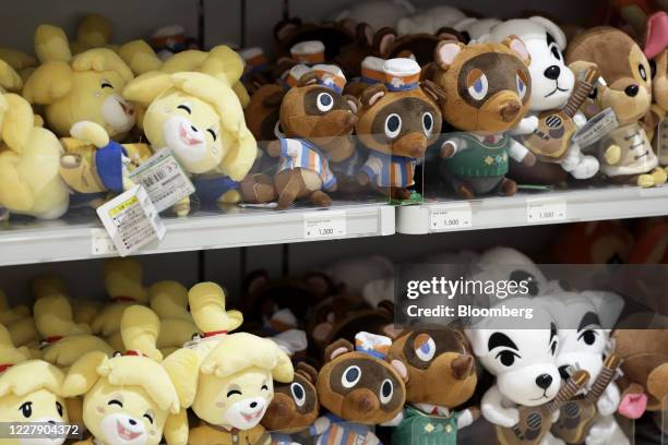 Plush toys of characters from the Nintendo Co. Video game Animal Crossing: New Horizons are displayed for sale inside the Nintendo TOKYO store in...