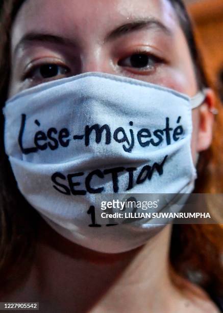 In this photo taken August 3 a protester wears a mask relating to Thailand's lese majeste laws during a Harry Potter-themed anti-government rally at...