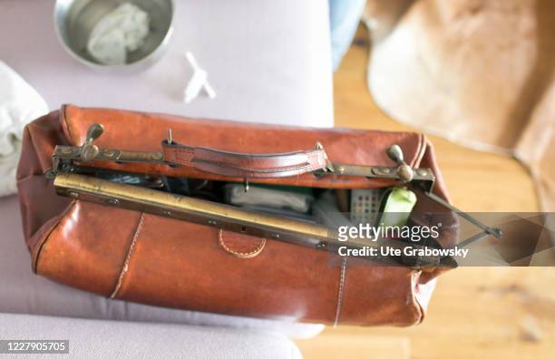 In this photo illustration a midwife case is placed on a sofa on March 18, 2019 in Bonn, Germany.