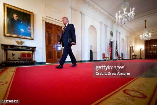 President Donald Trump arrives for a signing ceremony for the Great American Outdoors Act in the East Room of the White House on August 4, 2020 in...