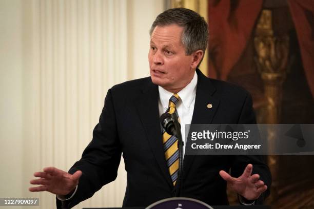 Sen. Steve Daines speaks during a signing ceremony for the Great American Outdoors Act in the East Room of the White House on August 4, 2020 in...