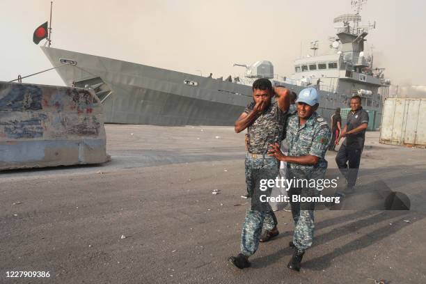 Bangladesh Navy officers near a warship seek medical help on the dockside following a large explosion at the Port of Beirut in Beirut, Lebanon, on...