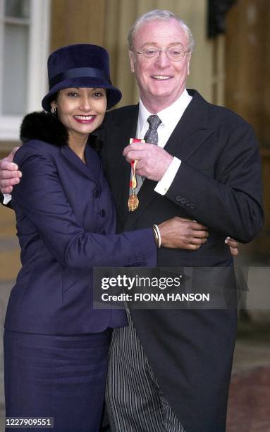 Actor Michael Caine with his wife Shakira at Buckingham Palace in London 16 November 2000, after receiving a knighthood from Britain's Queen...