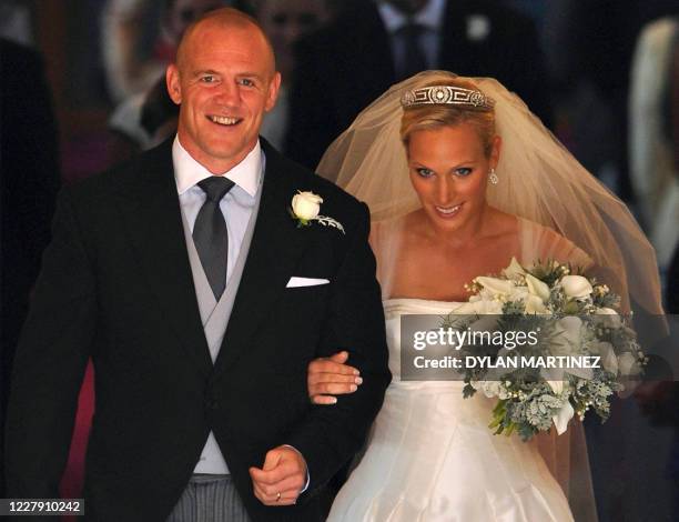 England rugby player Mike Tindall and his new wife Britain's Zara Phillips, granddaughter of Queen Elizabeth II, leave after their wedding ceremony...