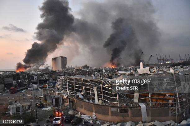 This picture taken on August 4, 2020 shows a general view of the scene of an explosion at the port of Lebanon's capital Beirut. - Two huge explosion...