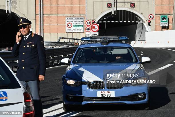 Highway Patrol police are seen before the opening of the new San Giorgio bridge for vehicles on August 4, 2020 in Genoa, northern Italy. - Italy on...