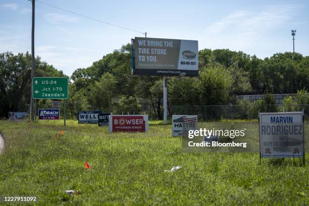 Campaign signs stand on display during the Kansas primary in Manhattan, Kansas, U.S., on Tuesday, Aug. 4, 2020. Kansas Republican voters on Tuesday...